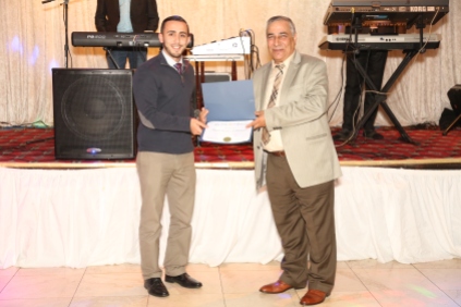 Representative of the Mayor of Patterson presenting a proclamation to Atef Elbeialy